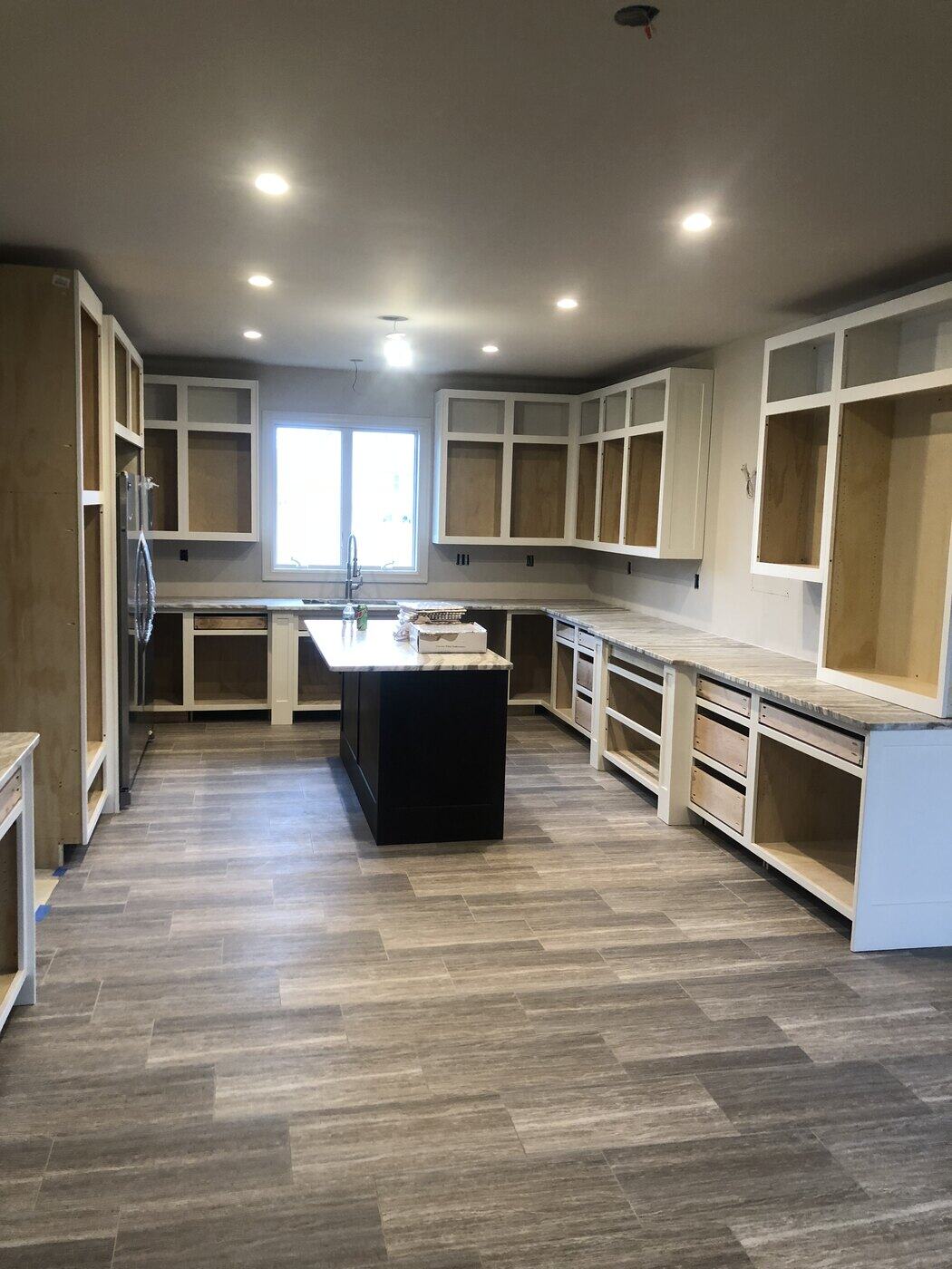 Wood-Plank Floors and Built Shower, finished